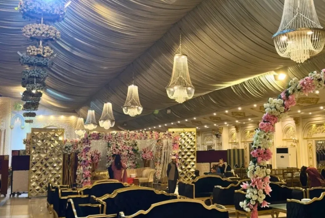 Floral entrance archway welcoming guests into the hall